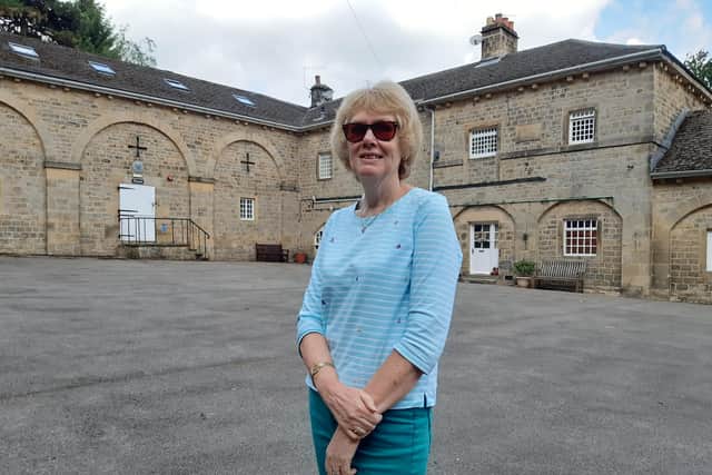 Gillian Nottingham in the courtyard. The buildings were originally the gardener’s cottage and the coachman’s cottage (later the chauffeur’s cottage), stables, storage for carriages, a tack room and a barn with mounting steps. There was also a hay loft.