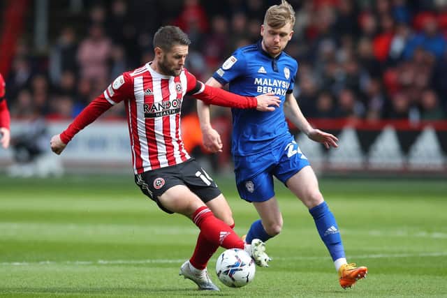 Tommy Doyle in action for Cardiff City last season, against Sheffield United and Oliver Norwood: Simon Bellis / Sportimage