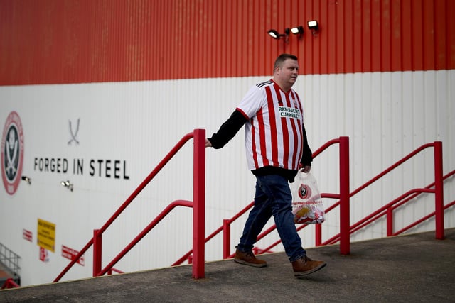 A fan arrives outside the stadium prior to the Emirates FA Cup Quarter Final match between Sheffield United and Blackburn Rovers at Bramall Lane on March 19, 2023 in Sheffield, England. (Photo by Jan Kruger/Getty Images)