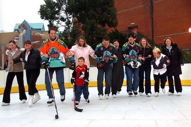 Steelers players, left to right: Rob Dopson, Ron Shudra, MarK Dutiaume along with Ron's son Cole, open the new Meadowhall Ice Rink outside the Oasis, as they help novice skaters, November 11, 2003