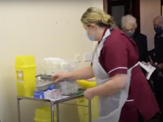 Healthcare assistant Marie Caley prepares for the arrival and another patient