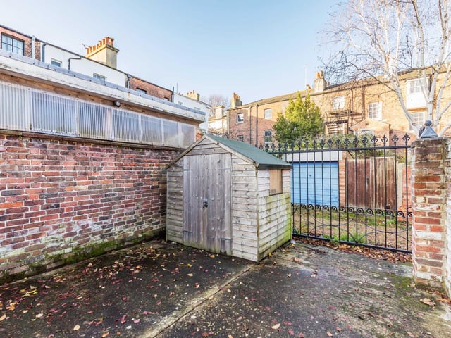 To the rear is a low maintenance split level garden laid to paving