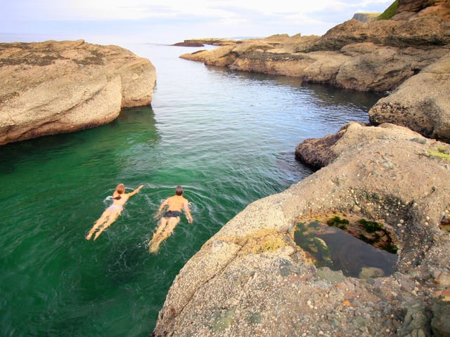 A stunning cave and cove complex where jet-black rocks meets deep-blue water and caverns, beaches and pools converge.