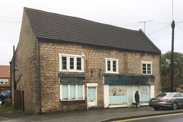 This former shop has planning consent for a change of use to a pair of semi-detached houses - guide price £75,000-plus.