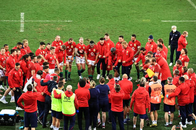 British & Irish Lions players and staff form a huddle to celebrate their victory over South Africa in the first Test.