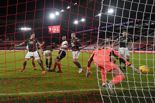David McGoldrick of Sheffield Utd scoring his sides second goal during the Premier League match at Bramall Lane, Sheffield. Picture date: 17th December 2020. Picture credit should read: Andrew Yates/Sportimage