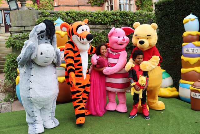 Make-A-Wish UK joined with Disney to create a special treat for Caleb Masaba-Kituyi, who had to have treatment for leukaemea. He is pictured with his sister and Disney characters.