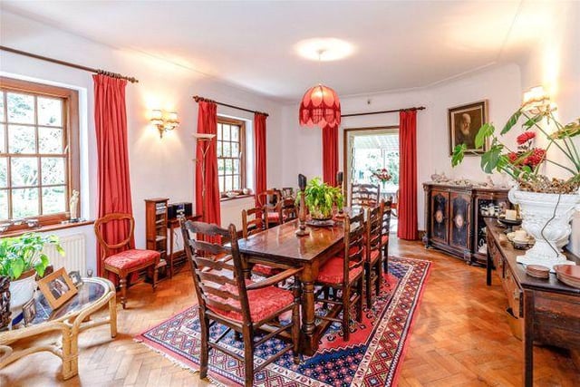 The sitting room further opens onto a separate dining room, which is large and oozes country charm.