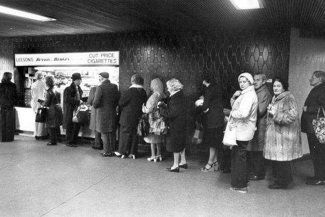 Beat the budget queue outside a cigarette kiosk in Sheffield's Hole in the Road on Budget Day - 29th March 1977