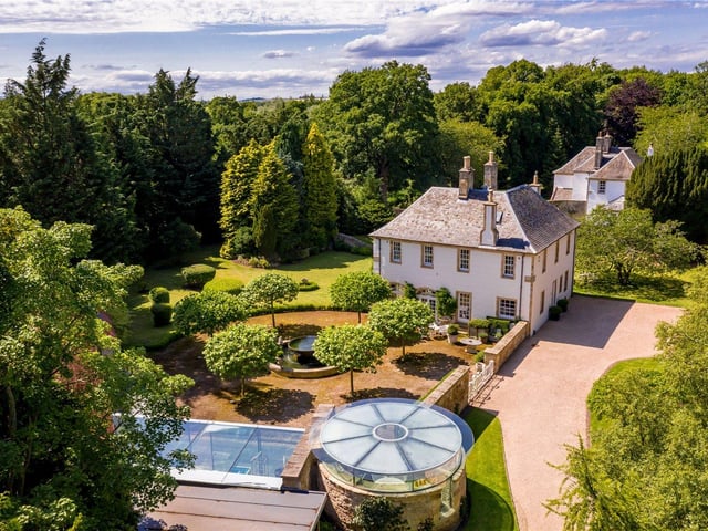 Aerial view of property with ice house in foreground.