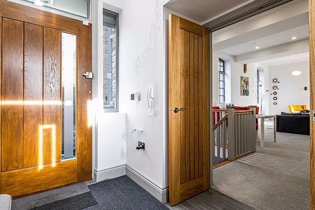 The large porch/vestibule is fitted with tasteful wooden doors that are attractive and extremely practical.