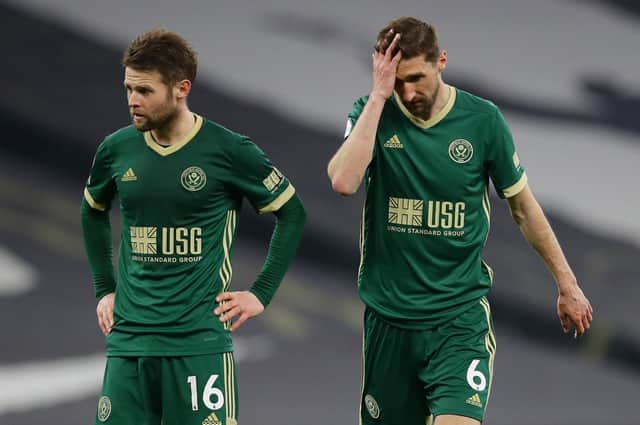 Oliver Norwood and Chris Basham react after Sheffield United's defeat at Spurs: David Klein / Sportimage
