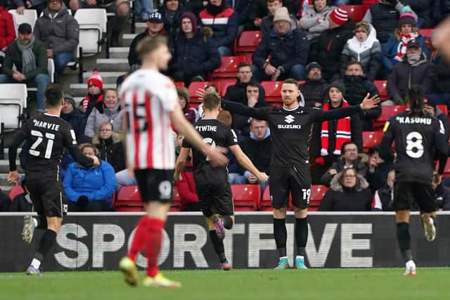 Milton Keynes Dons's Connor Wickham (second right) celebrates after scoring his sides second goal of the game during the Sky Bet League One match agaisnt Sunderland at the Stadium of Light. Picture: Owen Humphreys/PA Wire.