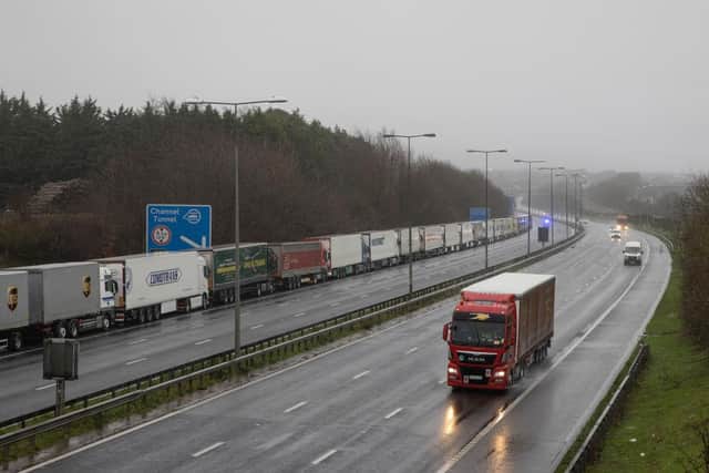 DOVER, ENGLAND - DECEMBER 21: Lorries queue during operation stack on the M20 towards Dover on December 21, 2020 in Dover, England. Citing concern over a new covid-19 variant and England's surge in cases, France temporarily closed its border with the UK late Sunday, halting freight and ferry departures from the port of Dover for 48 hours. France also joined several other European countries in stopping rail and air travel from the UK. (Photo by Dan Kitwood/Getty Images)