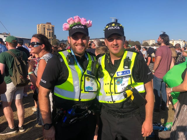 Tom Stark and Will Cantlie, community engagement officers donning flower crowns while looking after the crowd at Razorlight at Victorious