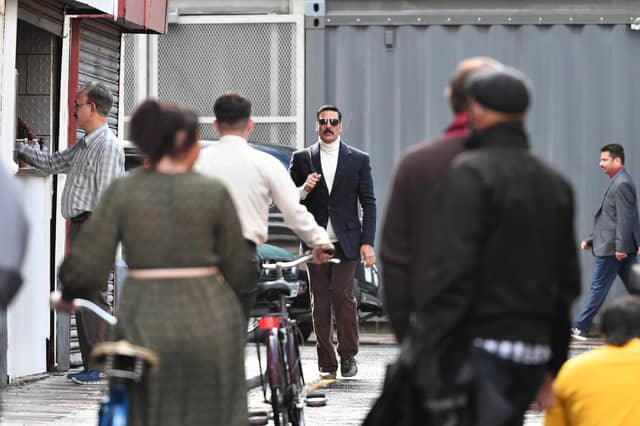 Akshay Kumar looking suave in a blue blazer and turtle neck sweatshirt and brown trousers. Pictures by John Devlin.