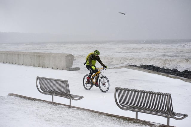 Brrr ..., this looks cold!
A brave cyclist takes a trip along the Prom in Kirkcaldy in a snow storm in 2018 (Pic: George McLuskie)