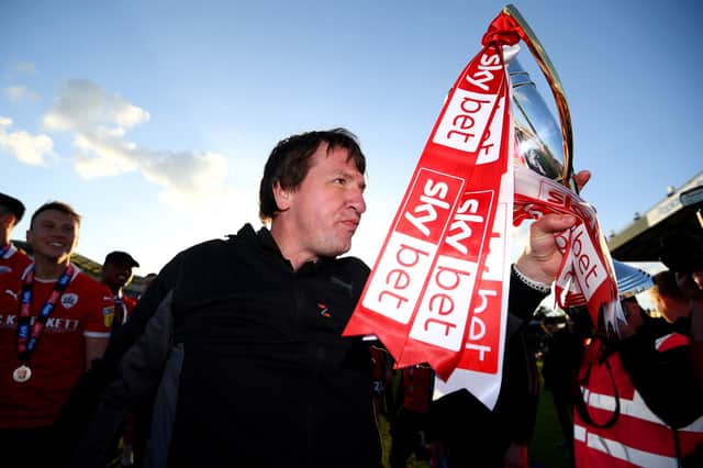 BRISTOL, ENGLAND - MAY 04: Daniel Stendel, Manager of Barnsley celebrates with trophy as his team are promoted following their restul in the Sky Bet League One match between Bristol Rovers and Barnsley at Memorial Stadium on May 04, 2019 in Bristol, United Kingdom. (Photo by Harry Trump/Getty Images)