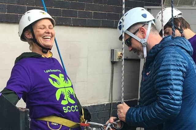 Gayle Dooley during her fundraising abseil