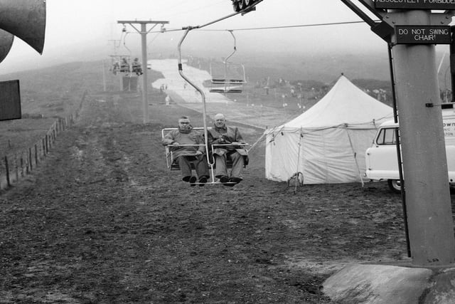 Trying out Hillend's new chair lifts on the first day of opening on September 30, 1966.