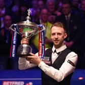 Judd Trump celebrates as he wins the 2019 Betfred World Snooker Championship. Photo by Nathan Stirk/Getty Images