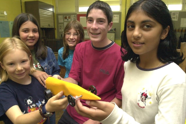 Carly Powell, Shakira Hussain, Rachel Grundy, Liam Adkins and Faiza Khan  with  their  Gas propelled formula 1  Drag Place car which they have built And raced at a summer school held at the Hinde House School  in 2001