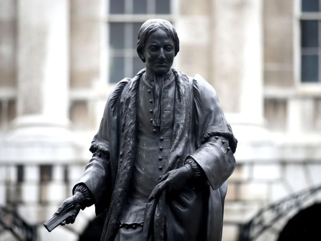 Thomas Guy founded Guy's Hospital in the 18th century and had shares in the South Sea Company which was involved in the slave trade. The hospital said that the statue would be removed, but not when