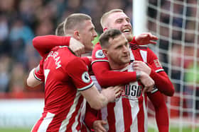 Billy Sharp celebrates with his SHeffield United teammates after scoring their what woud be the last Blades goal before the shutdown against Norwich City at Bramall Lane on March 07, 2020 in Sheffield, United Kingdom. (Photo by Nigel Roddis/Getty Images)