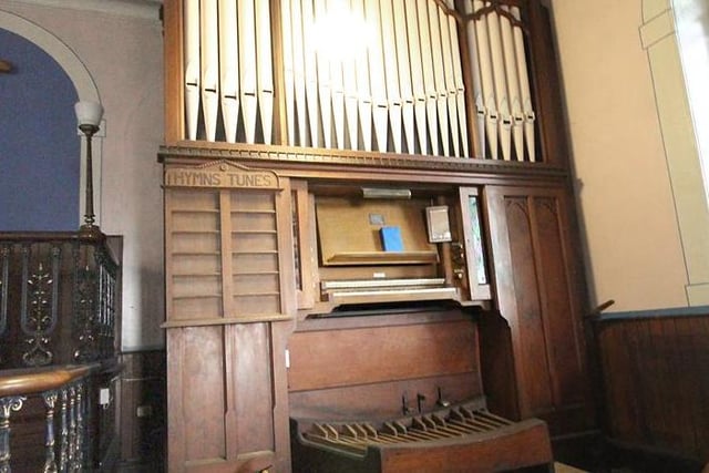 Here's the church organ, complete with its wooden board for displaying hymn numbers.