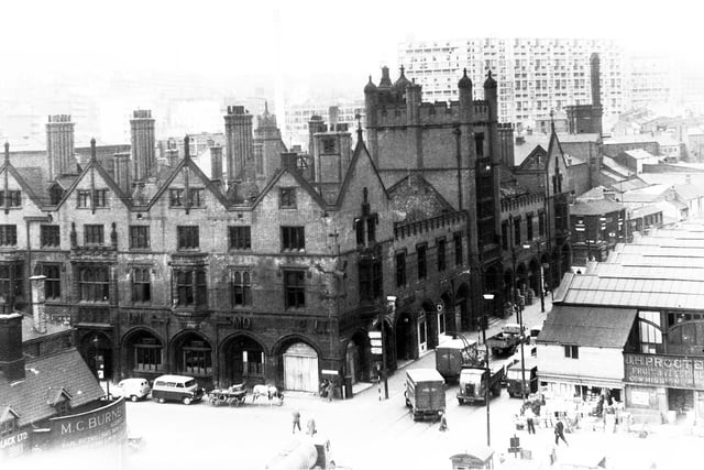 General view of the old Sheffield Corn Exchange, Sheaf Street, showing the Park Hill redevelopment flats in the background and part of the wholesale fruit market, July 1959.  The Corn Exchange was built in the 1880s but was severely damaged by fire in 1947 and demolished in 1962.  An end to one of the city's most handsome buildings.