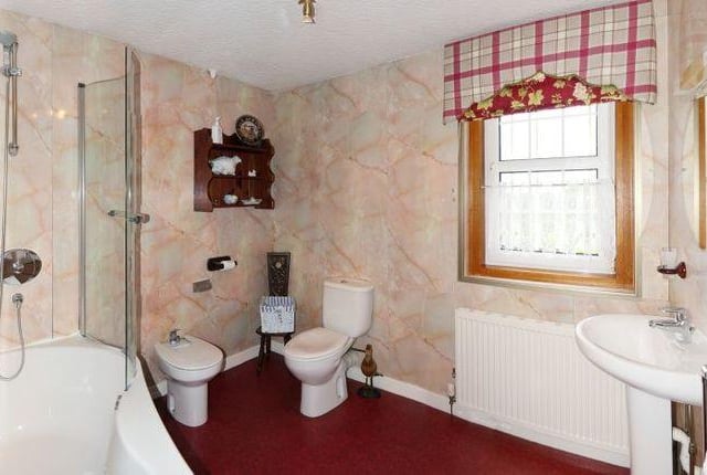 The property features a large family bathroom