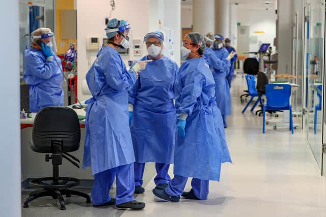 Health workers wearing full personal protective equipment (PPE) on the intensive care unit (ICU)