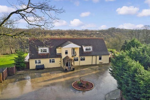 This five bedroom house has about 6.5 acres of private woodlands, views over went valley and an outdoor pool.