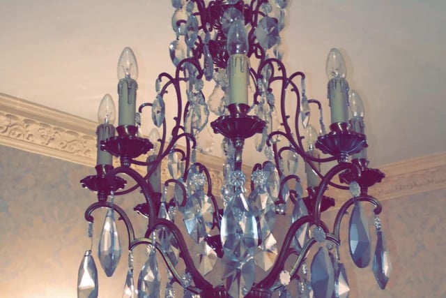 One of the many chandeliers boasted by the mysterious property.