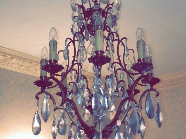 One of the many chandeliers boasted by the mysterious property.