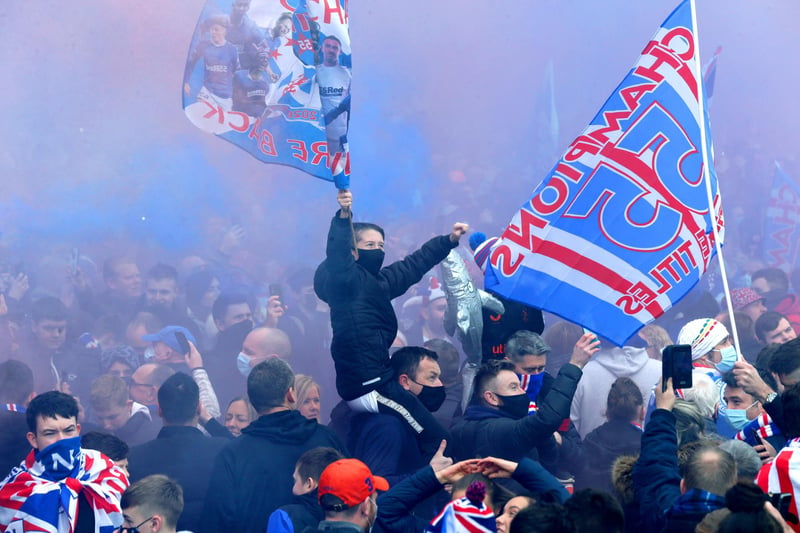 Rangers fans celebrate outside of the Ibrox Stadium after Rangers win the Scottish Premiership title.