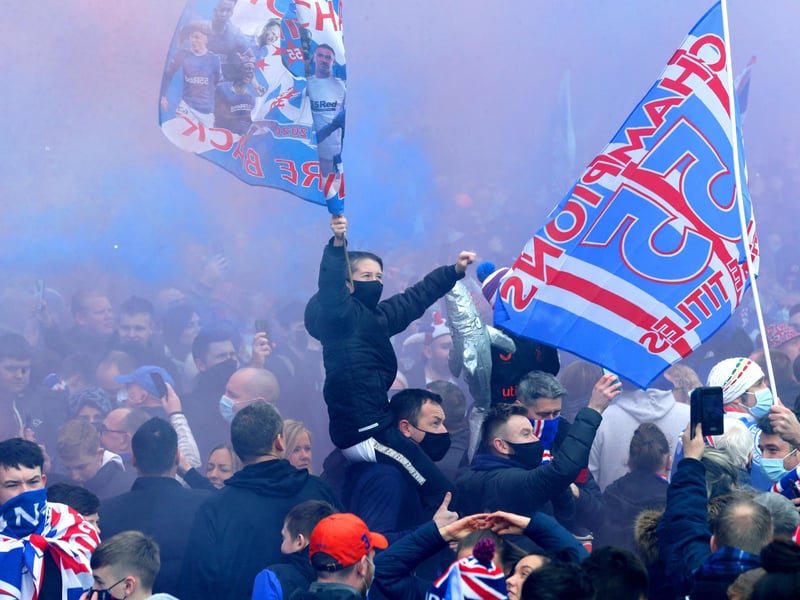 Rangers fans celebrate outside of the Ibrox Stadium after Rangers win the Scottish Premiership title.