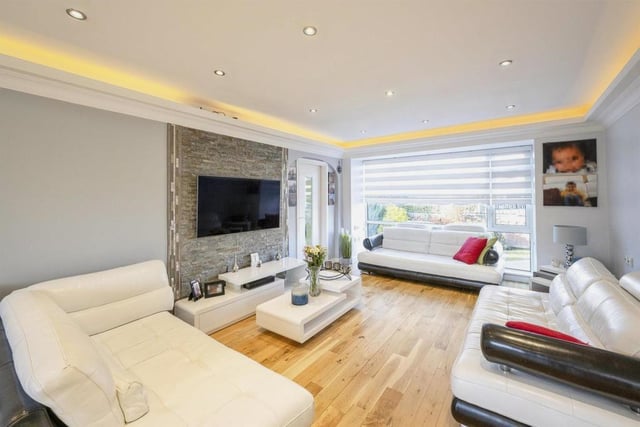 Lounge - 
With a front facing double glazed window, a central heating radiator, wooden floors, mood lighting and down lights to the ceiling. This room has been decorated in a contemporary style with a feature tiled wall which gives provision for a wall mounted TV.