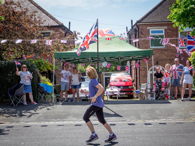 Neighbours celebrating with social distancing in Woodfield Avenue, Farlington