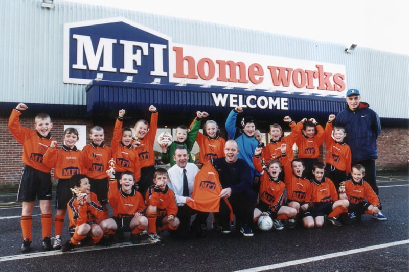 MFI sponsored the under 9s in 2001. The team is pictured with, Bill Parkinson, MFI Doncaster store general manager, and Gary Paulett, team manager.
