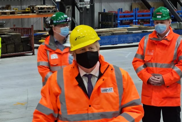 Mr Johnson met apprentices under a 107m long blade in one of the factory’s hangars.