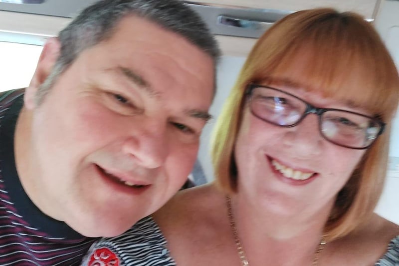 Susan and her other half in their new caravan last year