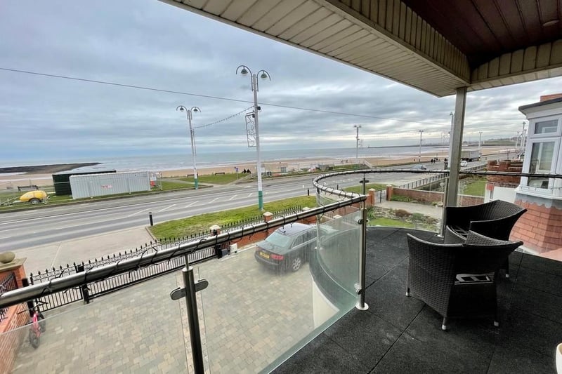 This four bed property is light, spacious and boasts a stunning garden and balcony with impressive coastal views.