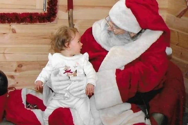 Bonnie giving Santa her Christmas list ready for December 25.
