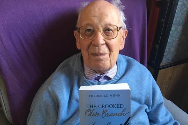 Frederick Munn with his first novel The Crooked Olive Branch