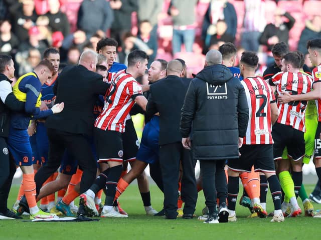 Sheffield United's Wes Foderingham and Shayne Lavery of Blackpool were both sent off after an on-field melee after the final whistle at Bramall Lane on Saturday: Lexy Ilsley / Sportimage