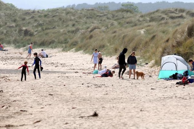 By the end of May, fine weather and the easing of lockdown measures encouraged people to get out and about, including Beadnell beach.