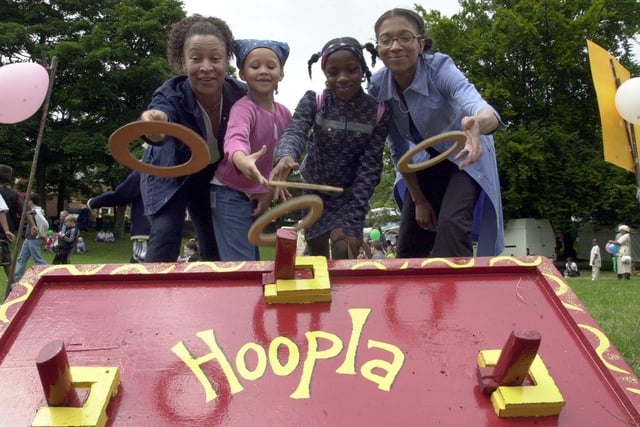 Having a go on the hoopla in aid of the children's project at the black women's resource centre are, left to right, Sharon Brown, Naoimi Coldwell, 6 , Kamara Thomas, 9 and Shannel Johnson. Picture taken at the 2001 Sheffield multi-cultural festival, Abbeyfield Park