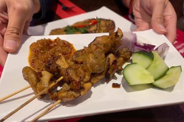 The chicken satay was served with cucumbers, red onions, and Spicy Peanut Sauce on the side.