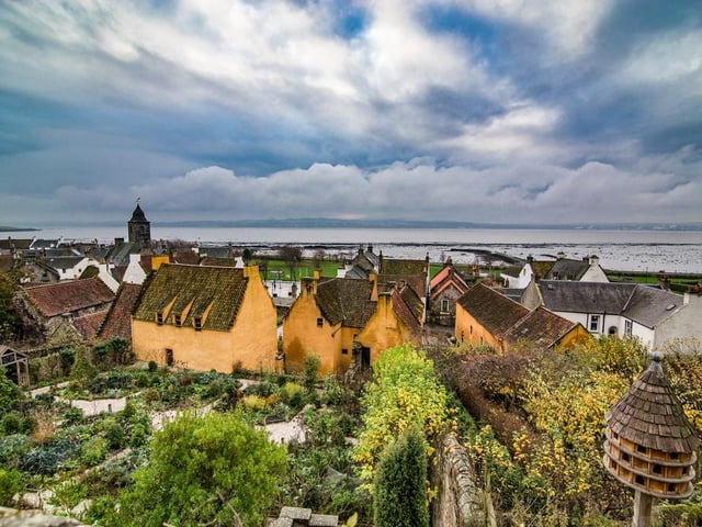 Used in several episodes of the hit TV series Outlander, the restored village is home to cobbled streets and red-roofed buildings.